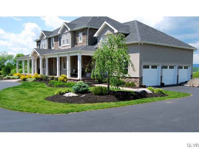 513 Lefevre Road Easton, PA 18040 - Photo 8 of 25 a black and white house with a yard and plants