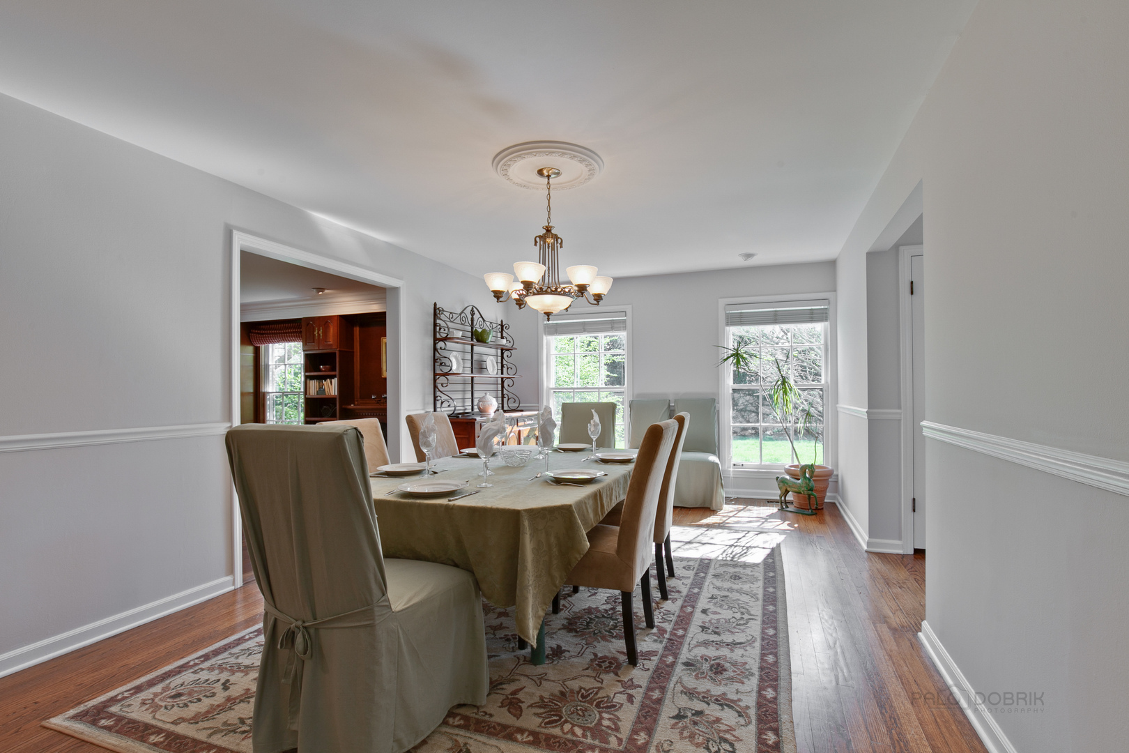 1991 Pheasant Trail Inverness, IL 60067 - Photo 11 of 53 a dining room with furniture a chandelier and wooden floor