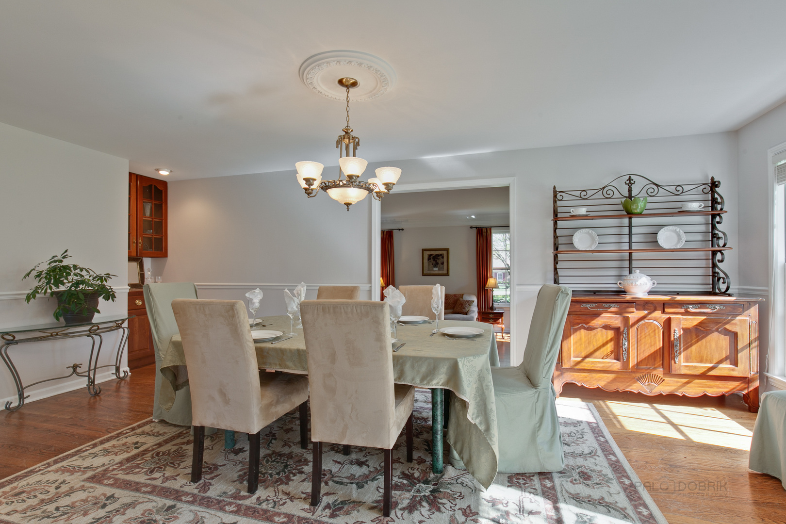 1991 Pheasant Trail Inverness, IL 60067 - Photo 12 of 53 a view of a dining room with furniture a chandelier and wooden floor