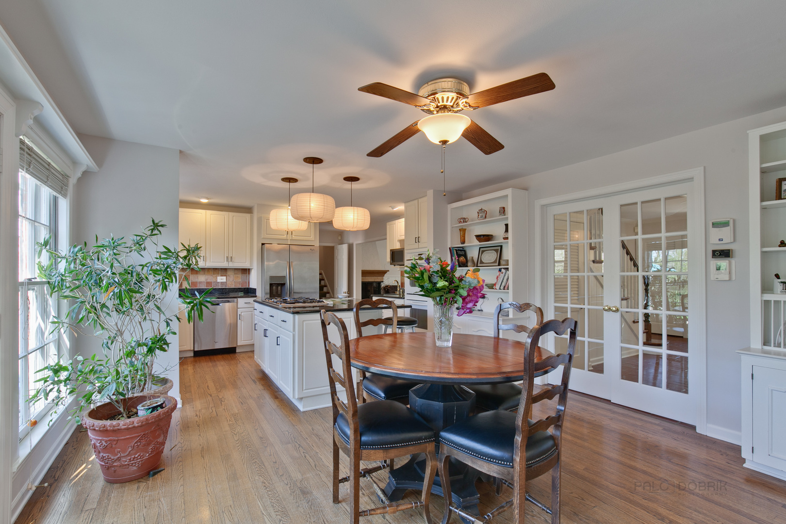 1991 Pheasant Trail Inverness, IL 60067 - Photo 16 of 53 a dining room with furniture potted plants and wooden floor