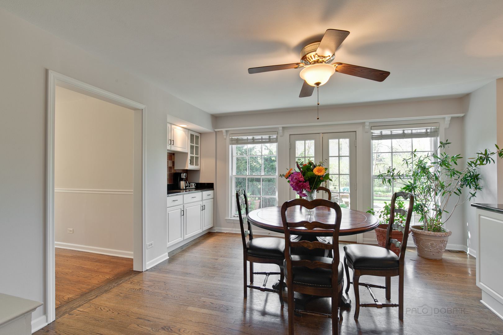 1991 Pheasant Trail Inverness, IL 60067 - Photo 17 of 53 a view of a dining room with furniture and a potted plant