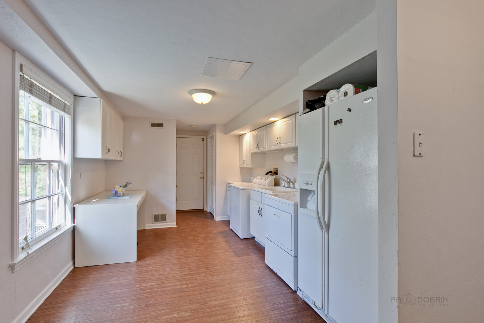 1991 Pheasant Trail Inverness, IL 60067 - Photo 24 of 53 a kitchen with cabinets and wooden floor
