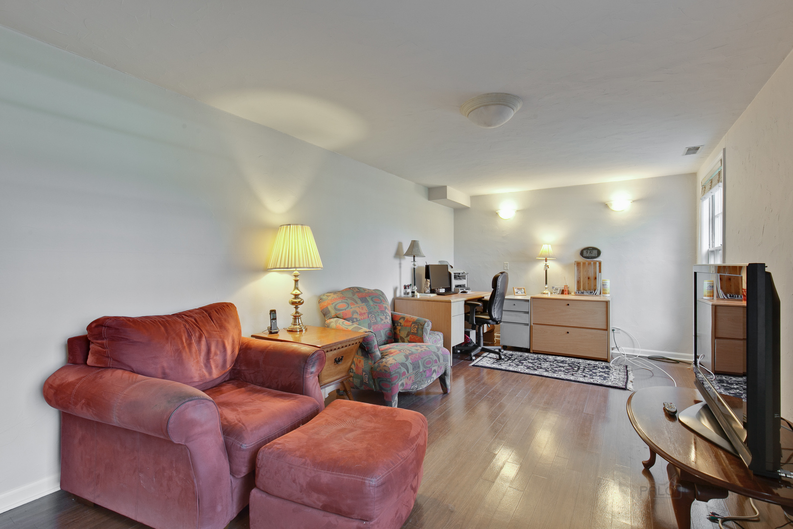 1991 Pheasant Trail Inverness, IL 60067 - Photo 26 of 53 a living room with furniture a flat screen tv and a fireplace