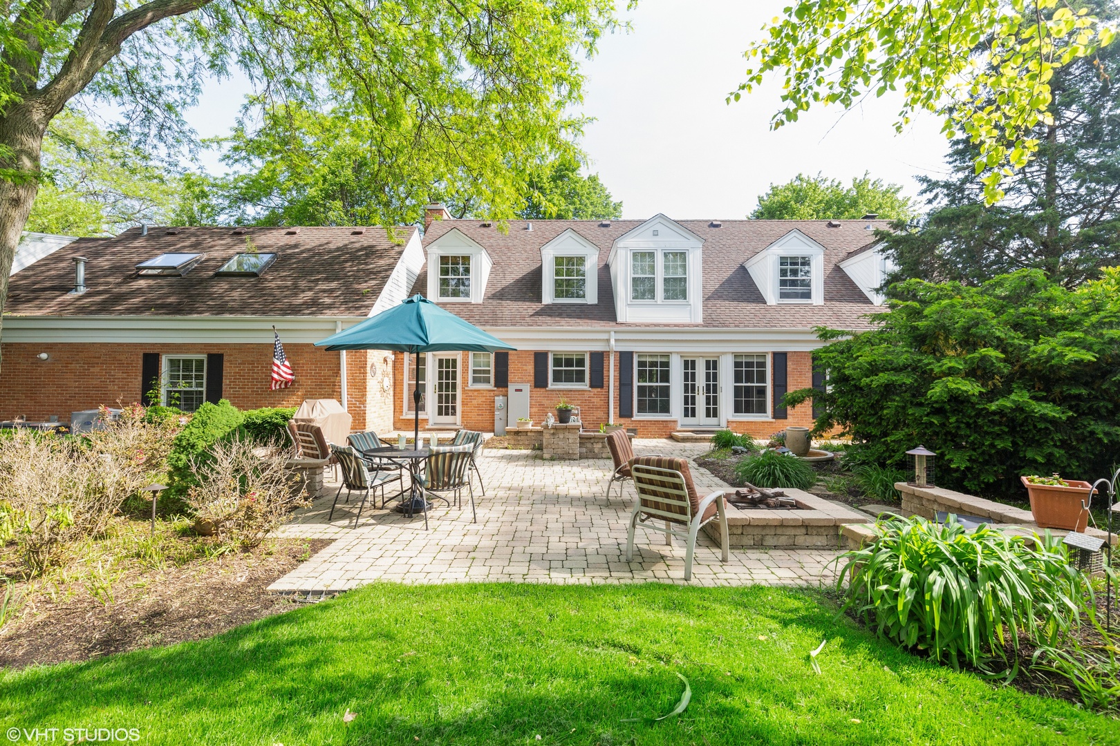 1991 Pheasant Trail Inverness, IL 60067 - Photo 46 of 53 a front view of a house with a yard table and chairs