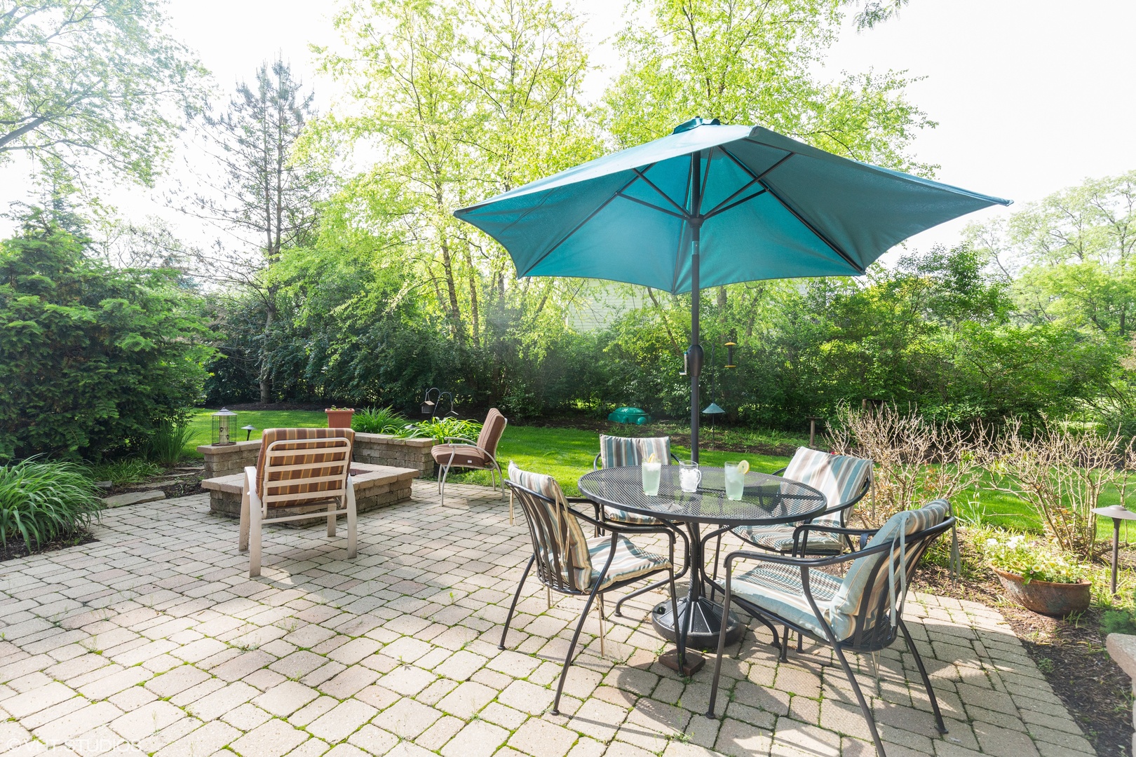 1991 Pheasant Trail Inverness, IL 60067 - Photo 49 of 53 a view of patio with chairs and table under an umbrella