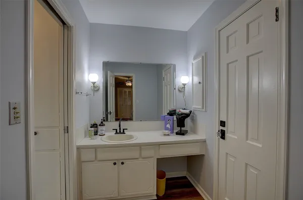 a bathroom with a sink and a mirror