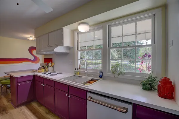 a kitchen with a sink and cabinets