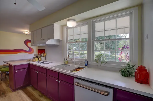a kitchen with a sink and cabinets