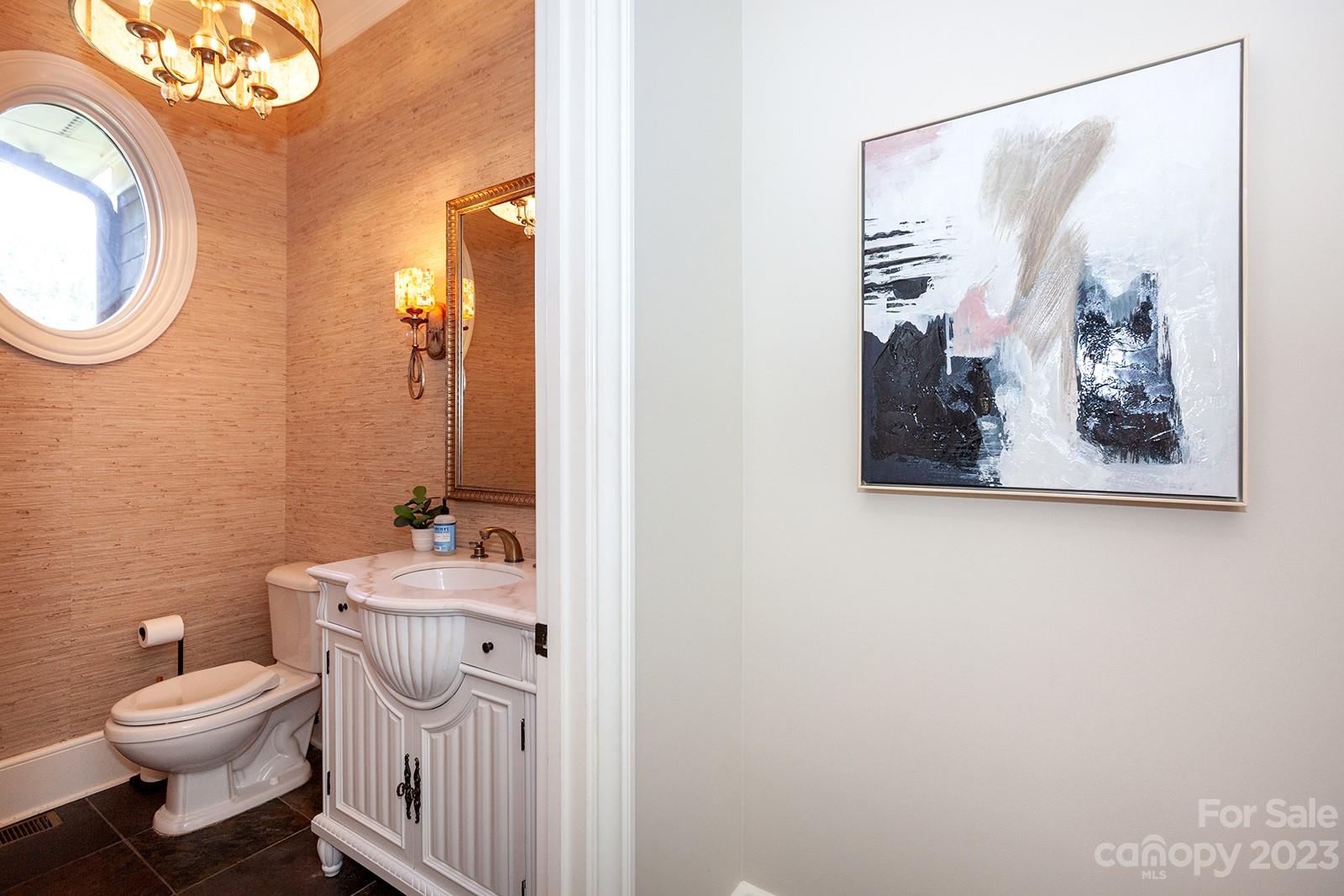 1925 Shoreham Drive Charlotte, NC 28211 - Photo 12 of 48 a bathroom with a toilet a sink and a mirror