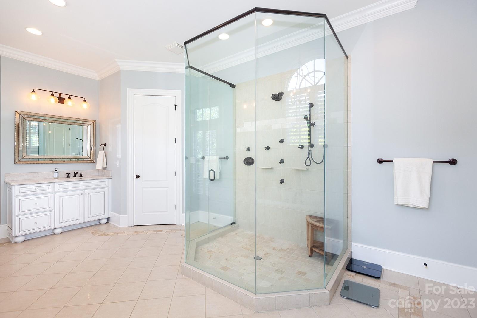 1925 Shoreham Drive Charlotte, NC 28211 - Photo 15 of 48 a bathroom with a tub shower sink and mirror
