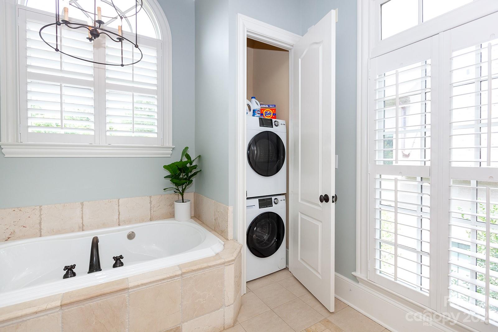 1925 Shoreham Drive Charlotte, NC 28211 - Photo 16 of 48 a bathroom with a tub and a window