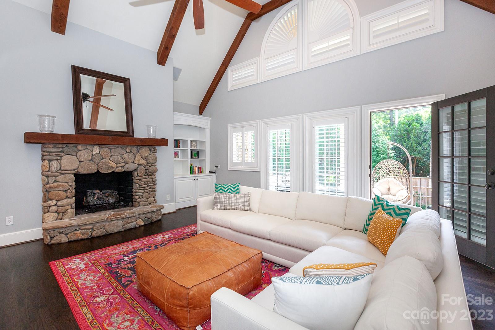 1925 Shoreham Drive Charlotte, NC 28211 - Photo 17 of 48 a living room with furniture a rug and a fireplace