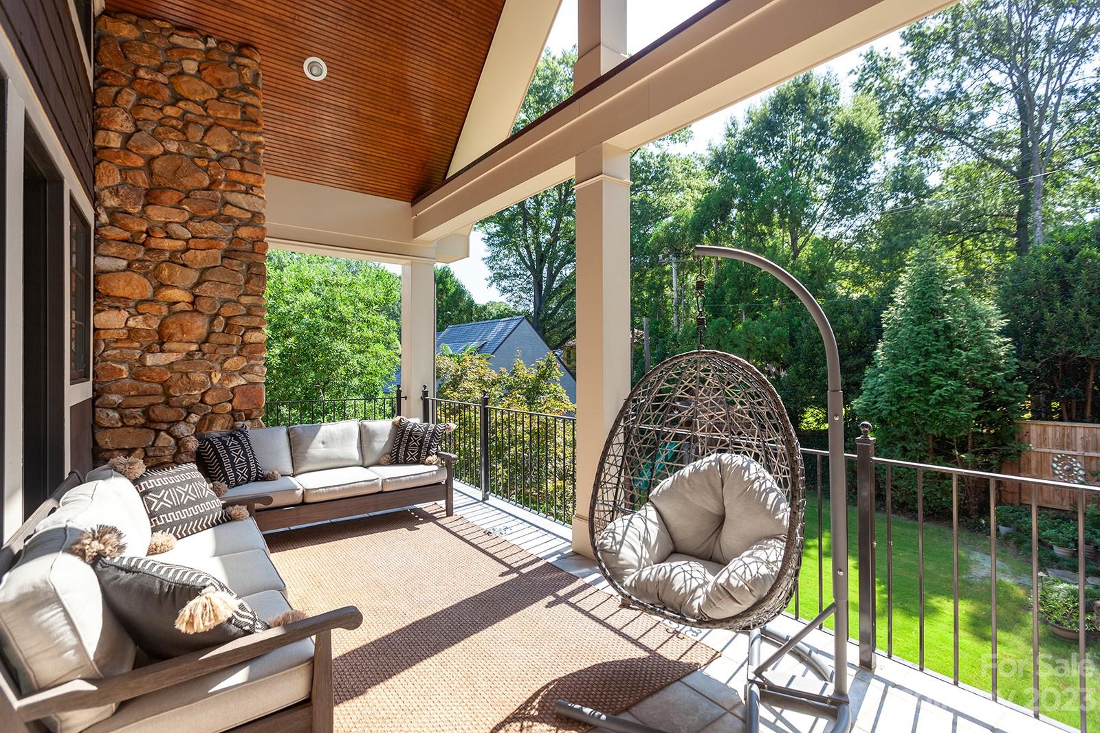 1925 Shoreham Drive Charlotte, NC 28211 - Photo 18 of 48 a view of a patio with couches chairs and a wooden deck