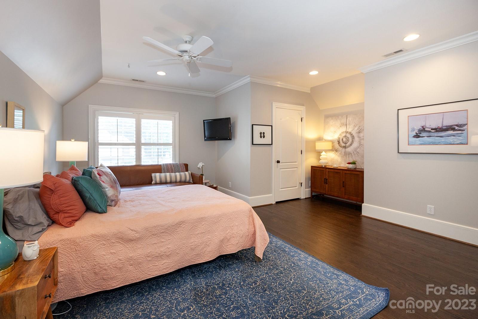 1925 Shoreham Drive Charlotte, NC 28211 - Photo 24 of 48 a bedroom with a bed and a couch