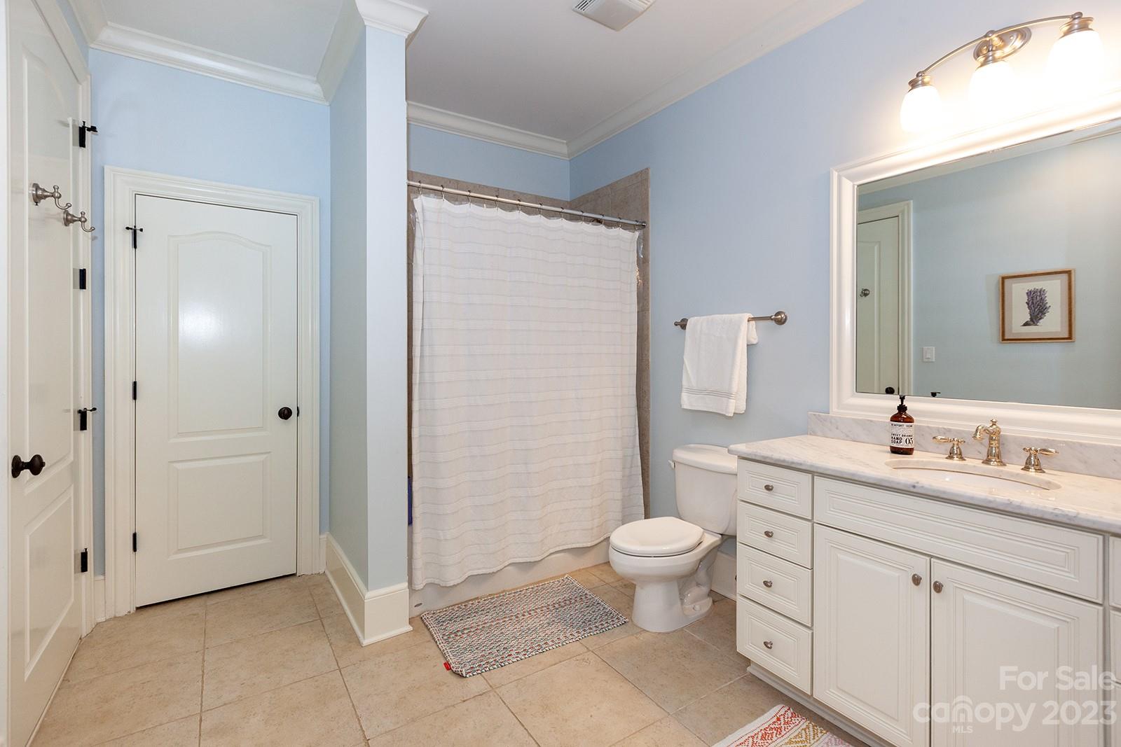 1925 Shoreham Drive Charlotte, NC 28211 - Photo 34 of 48 a spacious bathroom with a double vanity sink toilet and mirror