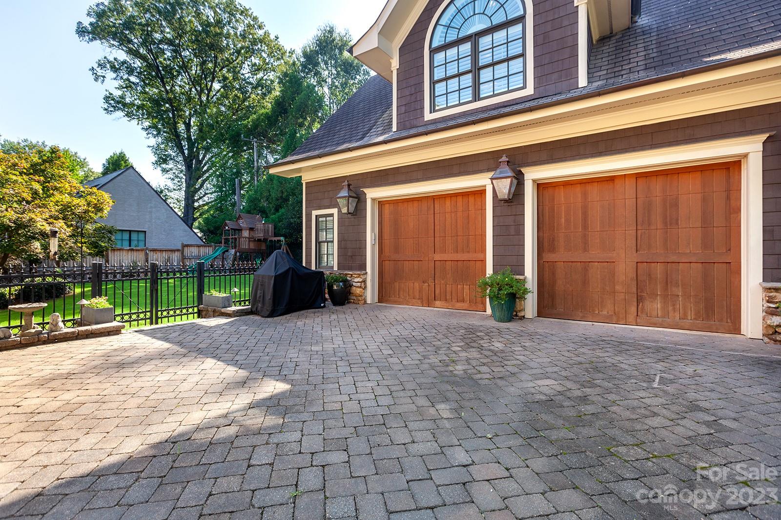 1925 Shoreham Drive Charlotte, NC 28211 - Photo 41 of 48 a front view of a house with a yard and garage