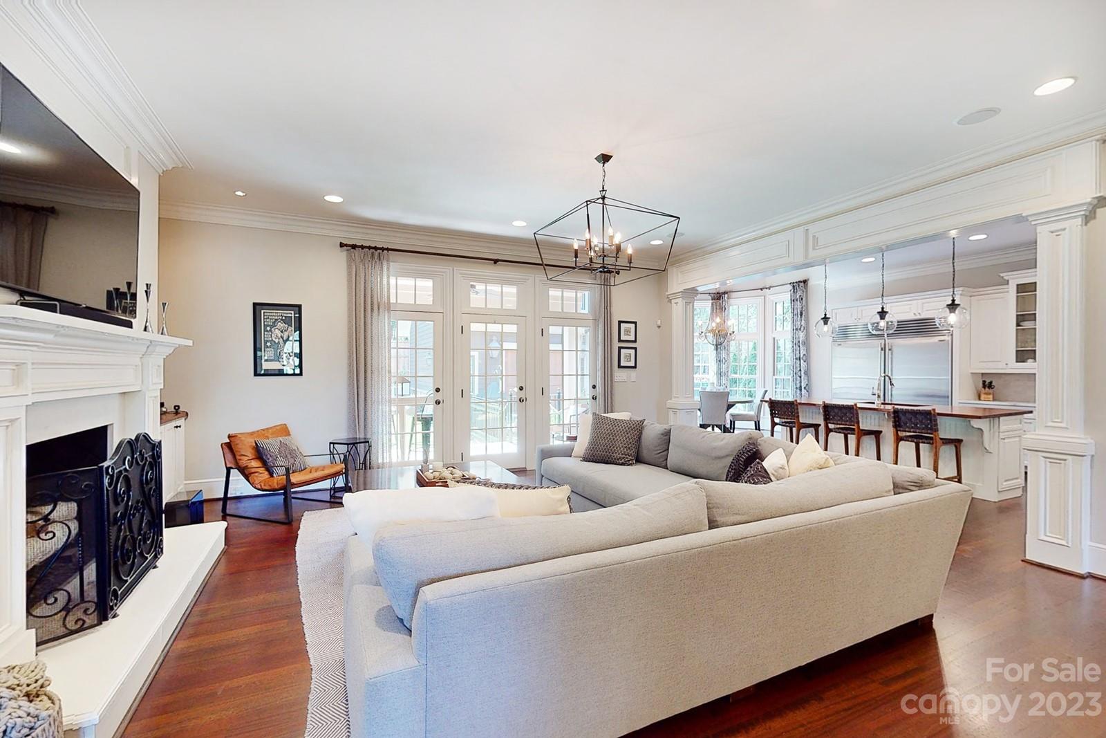 1925 Shoreham Drive Charlotte, NC 28211 - Photo 8 of 48 a living room with fireplace furniture and a chandelier