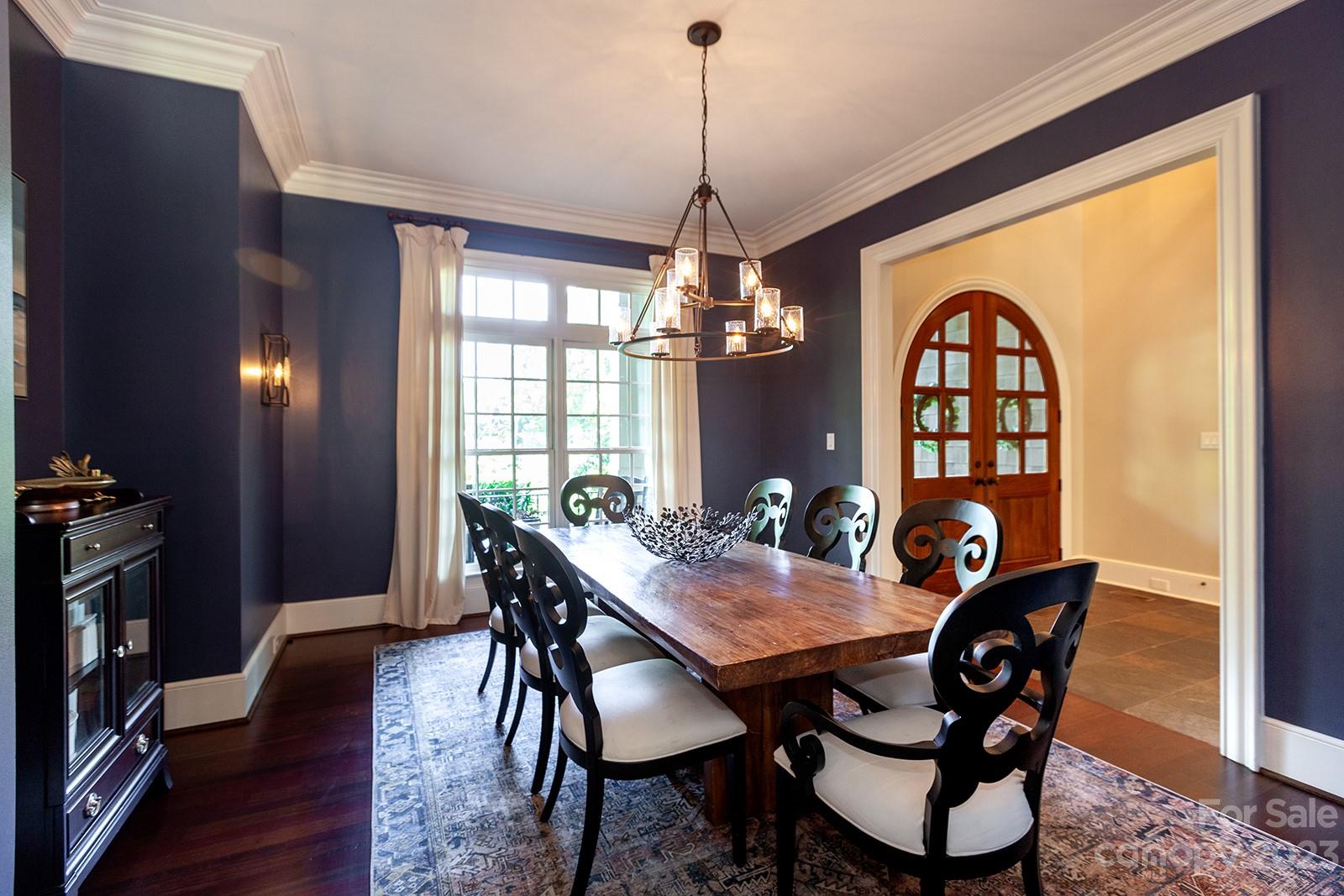 1925 Shoreham Drive Charlotte, NC 28211 - Photo 10 of 48 a view of a dining room with furniture window and wooden floor