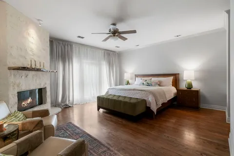 a bedroom with a bed and a fireplace