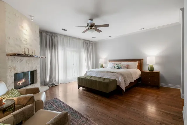 a bedroom with a bed and a fireplace