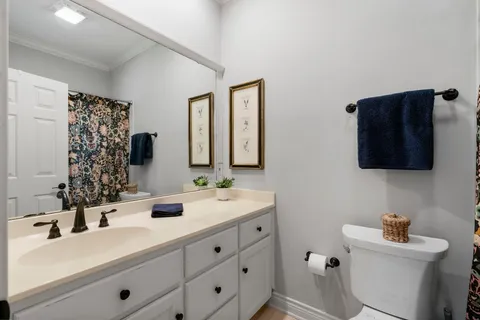 a bathroom with 2 sink and a mirror