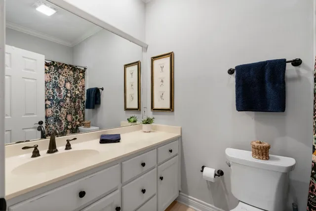 a bathroom with 2 sink and a mirror