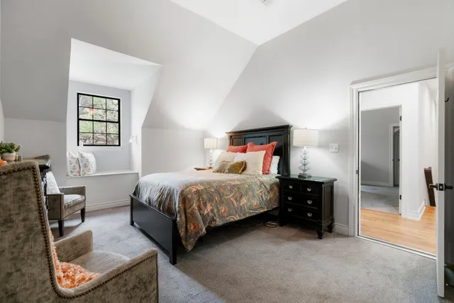 a bed room with a bed and a tv