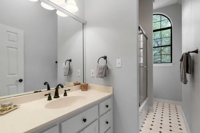 a bathroom with a sink and a mirror