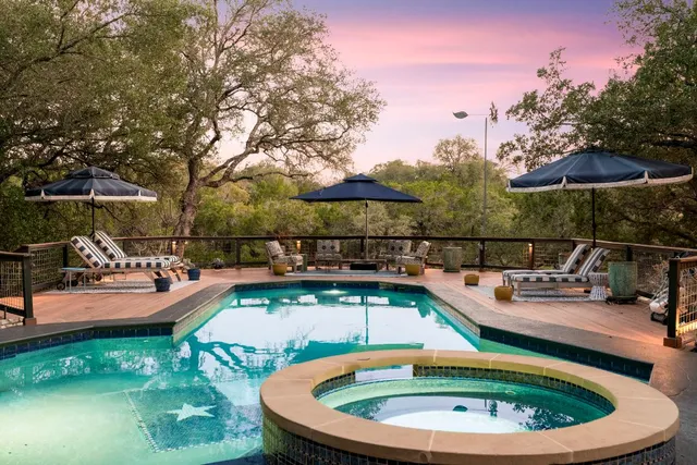 a view of a swimming pool with a patio