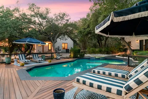 a view of swimming pool and patio
