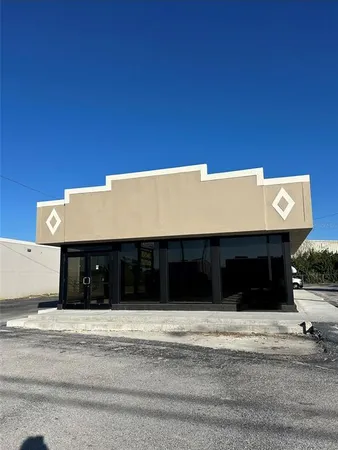 a view of a house with a parking space