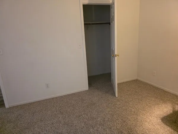 an empty room with closet