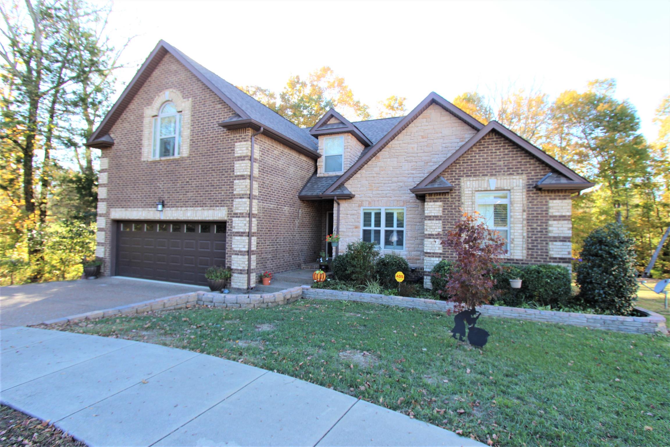 396 Abbey Road Lebanon, TN 37090 - Photo 1 of 23 a front view of a house with a yard and garage