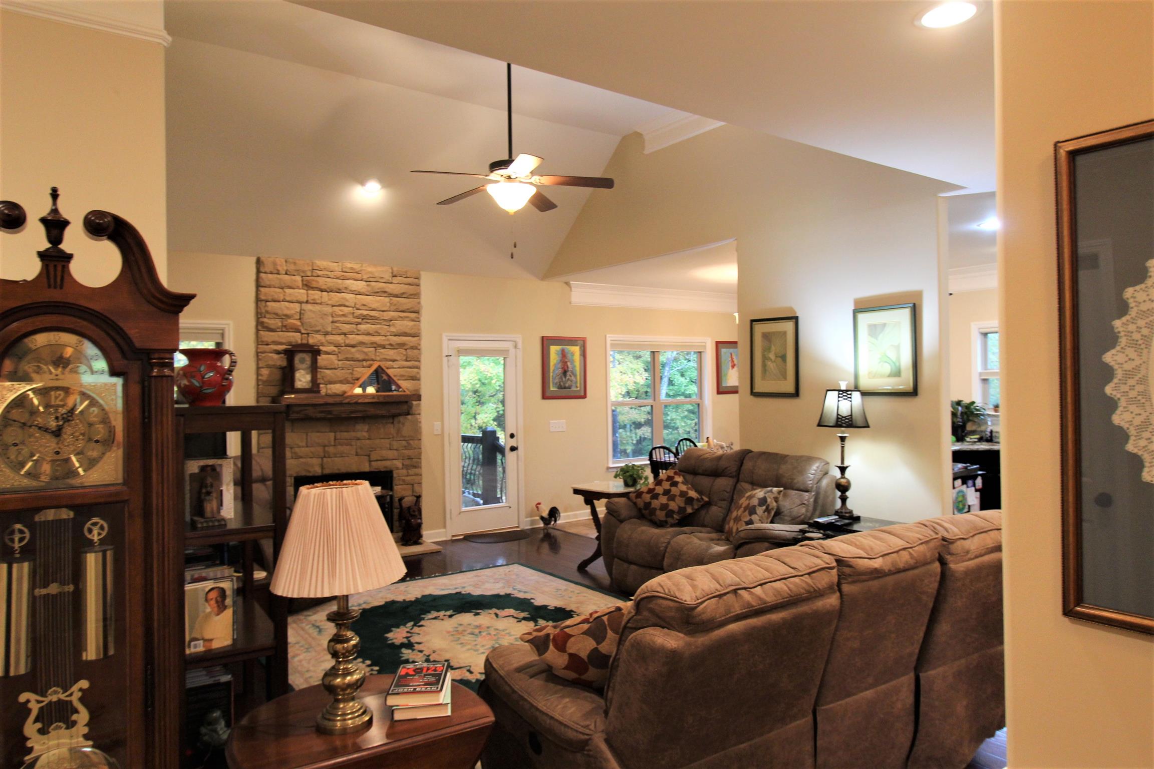 396 Abbey Road Lebanon, TN 37090 - Photo 2 of 23 a living room with furniture a fireplace and a chandelier