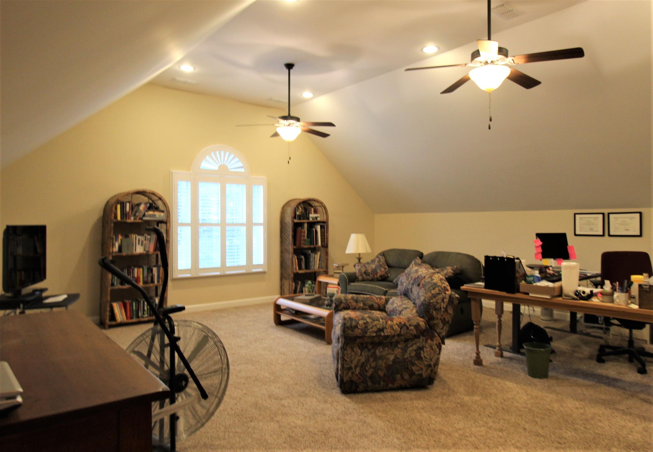 396 Abbey Road Lebanon, TN 37090 - Photo 17 of 23 a living room with furniture and a chandelier