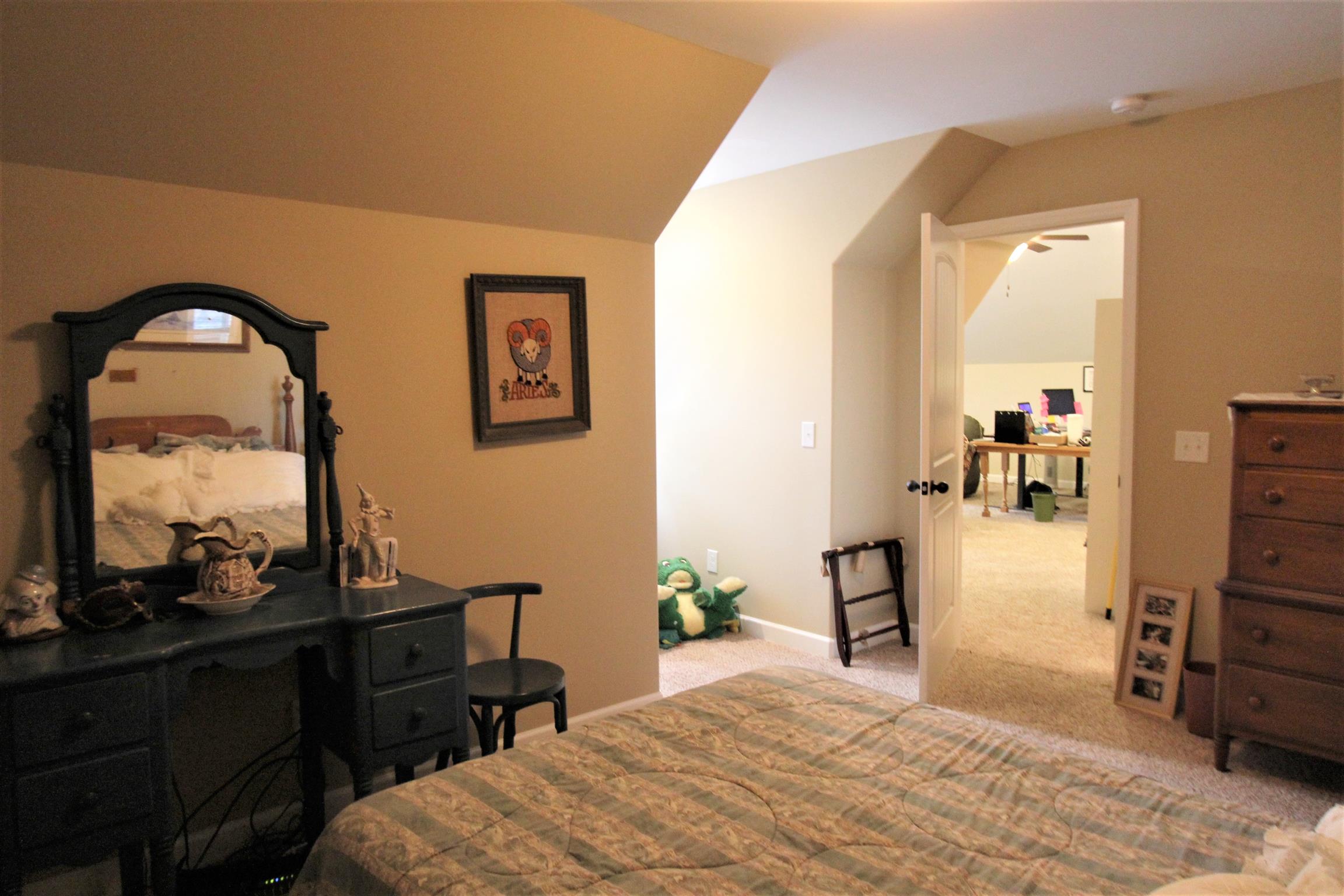 396 Abbey Road Lebanon, TN 37090 - Photo 20 of 23 a bedroom with a bed and dresser with mirror