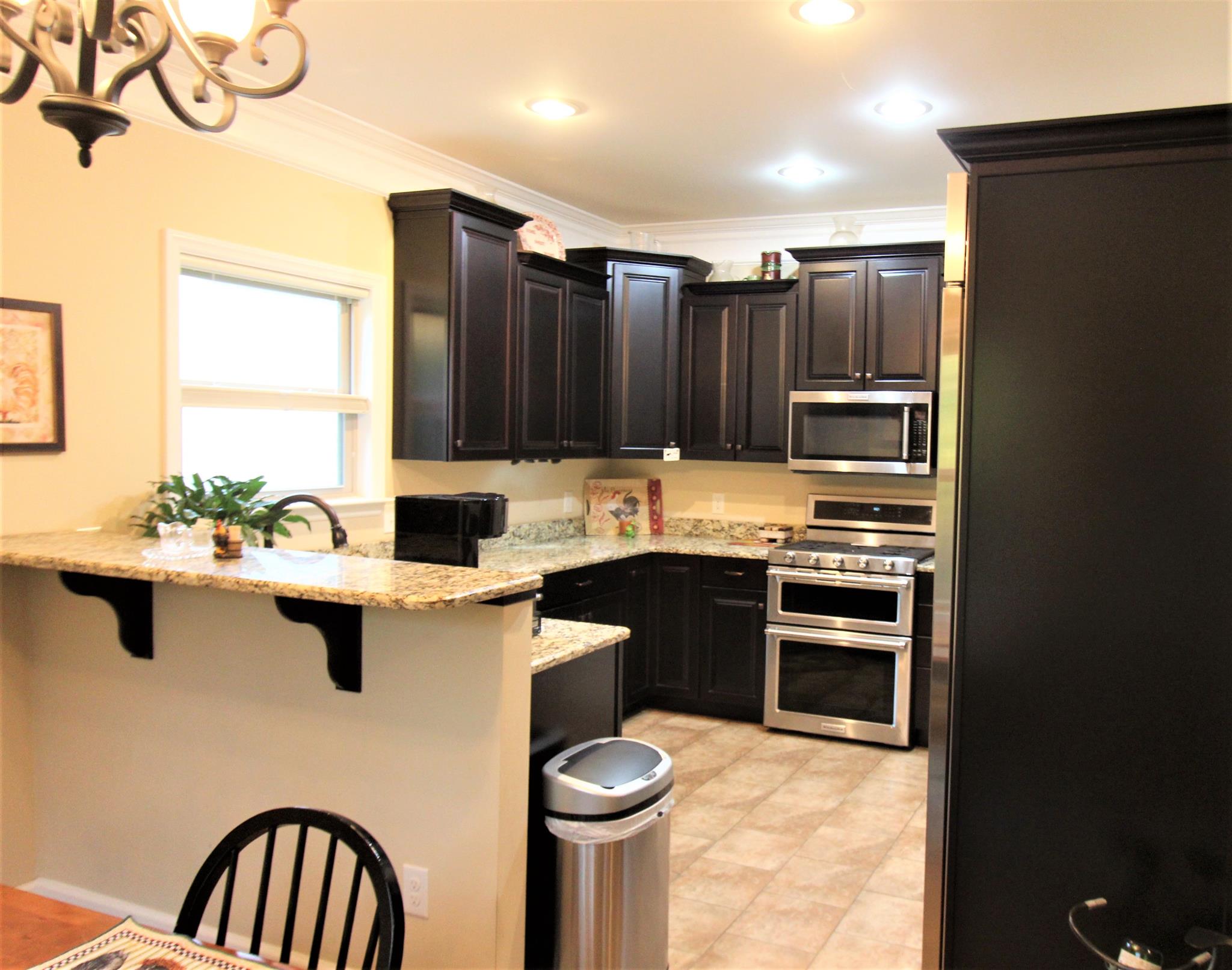 396 Abbey Road Lebanon, TN 37090 - Photo 7 of 23 a kitchen with stainless steel appliances a sink stove and refrigerator