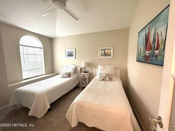 a bedroom with bed and window