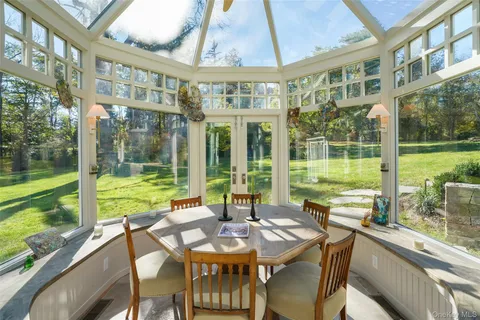 a view of a patio with a table chairs and balcony