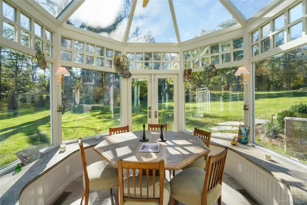 a view of a patio with a table chairs and balcony