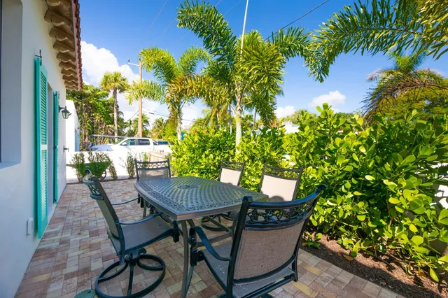 a view of a chairs and table in the patio
