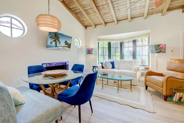 a view of a livingroom with furniture window and wooden floor