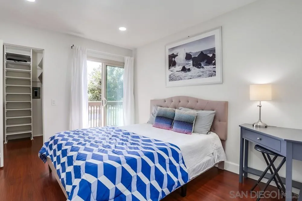 6314 Friars Road, Unit 116 San Diego, CA 92108 - Photo 17 of 36 a bedroom with a large bed and a window
