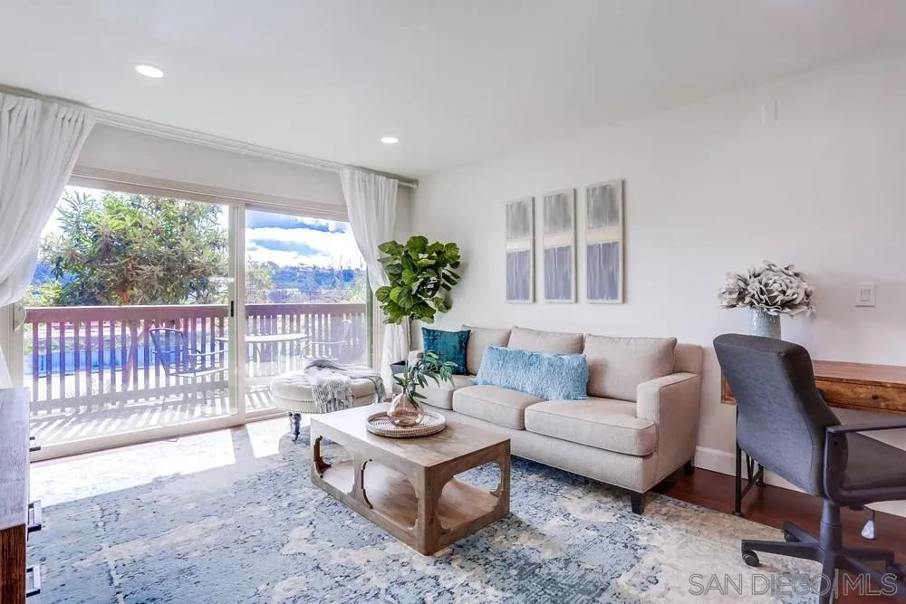 6314 Friars Road, Unit 116 San Diego, CA 92108 - Photo 2 of 36 a living room with furniture and a large window