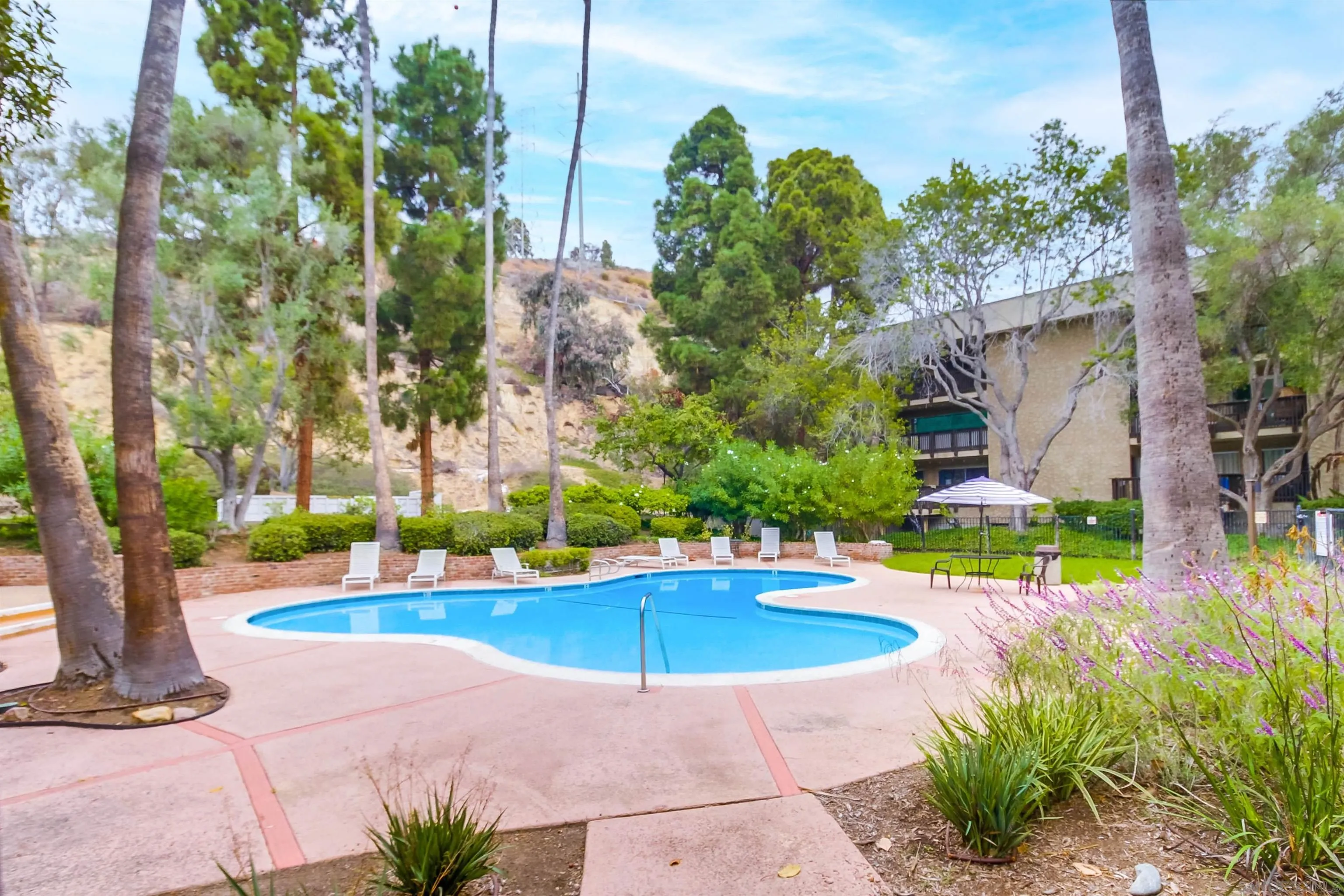 6314 Friars Road, Unit 116 San Diego, CA 92108 - Photo 26 of 36 a view of a swimming pool with a patio