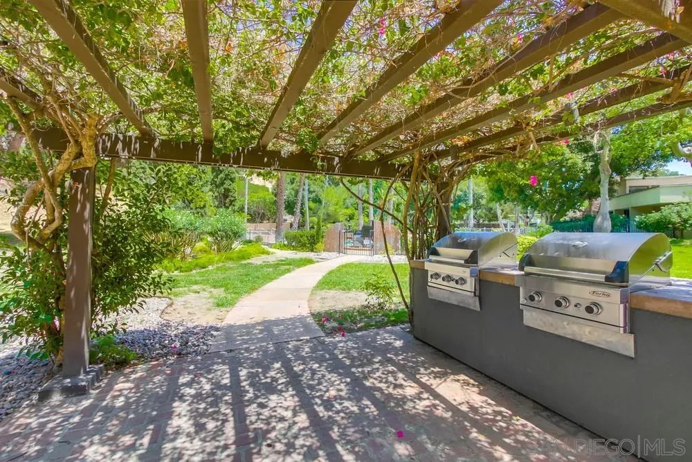 6314 Friars Road, Unit 116 San Diego, CA 92108 - Photo 35 of 36 a view of backyard with outdoor seating and green space