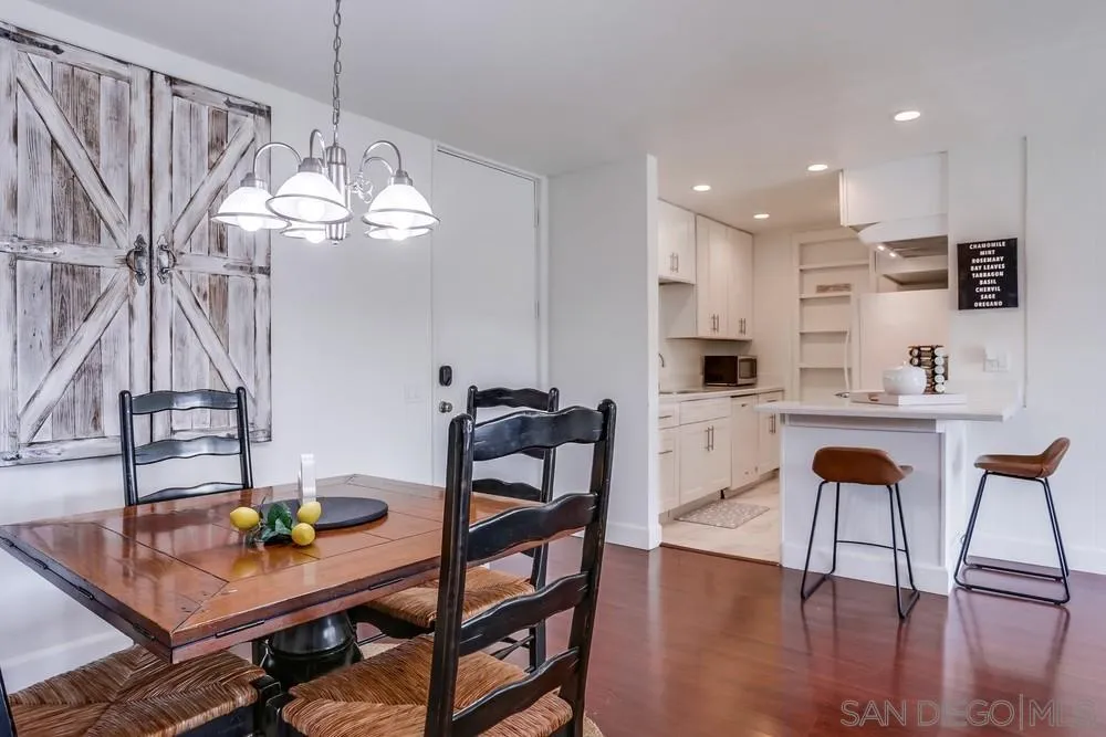 6314 Friars Road, Unit 116 San Diego, CA 92108 - Photo 5 of 36 a view of a dining room with furniture and wooden floor