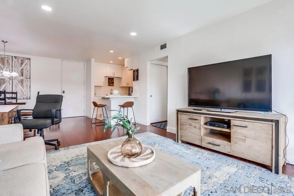 6314 Friars Road, Unit 116 San Diego, CA 92108 - Photo 7 of 36 a living room with furniture and a flat screen tv