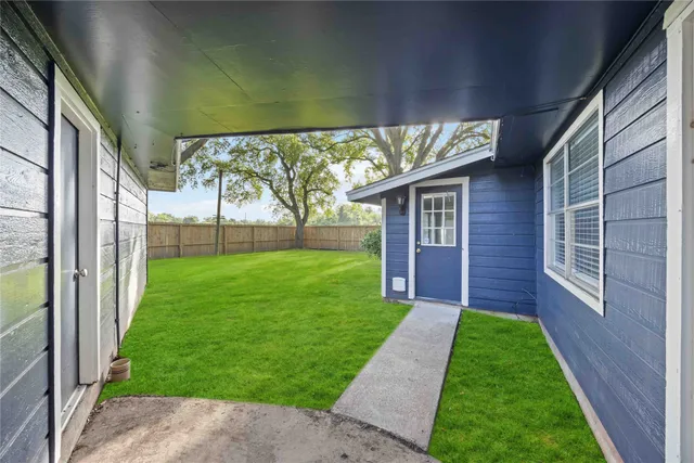 a view of yard with a porch