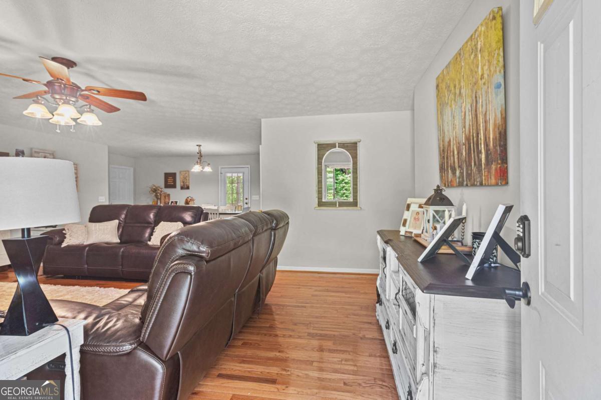 513 South Red Rock Road Toccoa, GA 30577 - Photo 12 of 47 a living room with furniture and a wooden floor